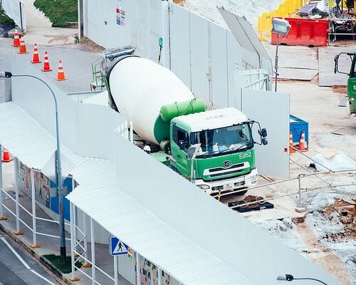 green-and-white-mixer-truck-at-the-construction-site