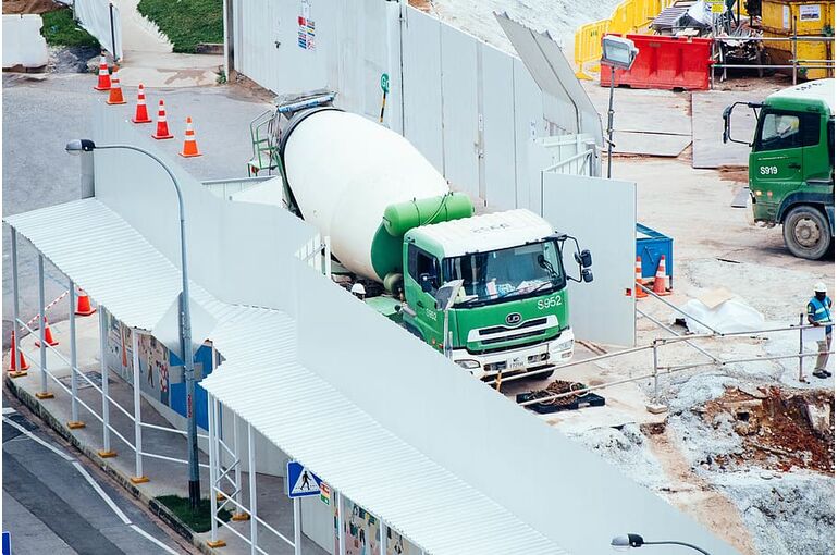green-and-white-mixer-truck-at-the-construction-site